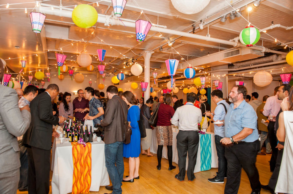 jos14ny024 Crowd of people sampling sakes on the table under Japanese paper lantern (2014 New York)