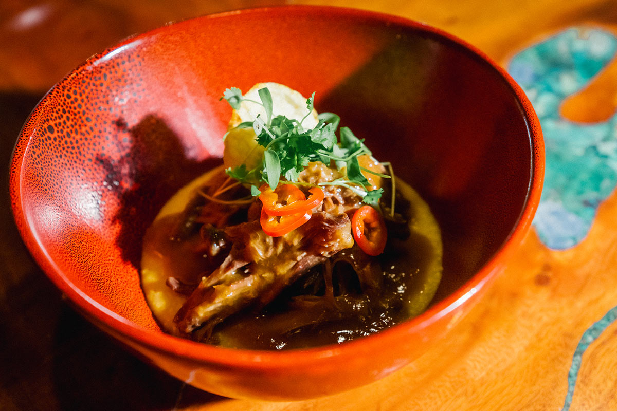 food2025Hi-the-fixx-haleiwa-01 Sake-Braised Oxtail Over Yellow Stone-Ground Okayu Grits by The Fixx Haleiwa (2025 Honolulu)